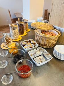 a table topped with bowls and plates of food at Hotel Alter Markt in Berlin