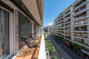 a balcony of a building with chairs on it at Houseloft CityView Hagia Sophia in Thessaloniki