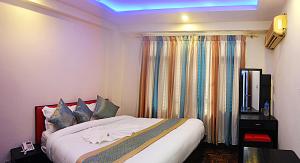 Rúm í herbergi á Hotel Gallery Nepal