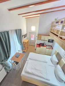 a large room with a bed and a kitchen at Marcel Apartments Leipzig in Leipzig +40 photos