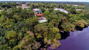 a house on an island in the middle of a river at Bela Vista Lodge in Novo Airão