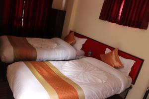 Rúm í herbergi á Hotel Gallery Nepal