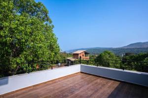 a balcony with a view of the mountains at Swara Villa Your Perfect Getaway in Jāmb