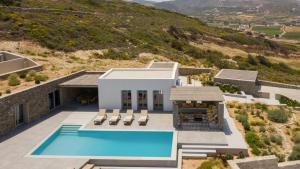 an aerial view of a house with a swimming pool at Villa Anelya in Parikia