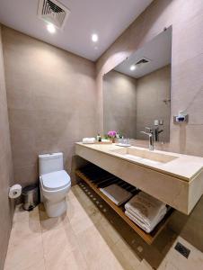 a bathroom with a sink and a toilet at Beautiful Apartment overlooking Samaná Bay in Cayo Vigía