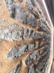 a close up of a stone wall at Le Roche-Velours in Paray-le-Monial