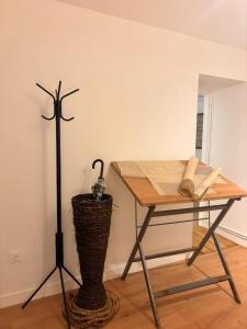 a table with a windmill on it next to a desk at Le Roche-Velours in Paray-le-Monial
