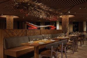 a row of tables and chairs in a restaurant at Hotel Podgorie Spa in Bukovel