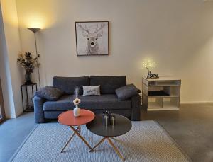 a living room with a couch and a table at Ferienwohnung Stenna SELVA an Toplage in Flims +32 photos