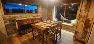 a dining room with a table and a window at Morada La Granja in Minas