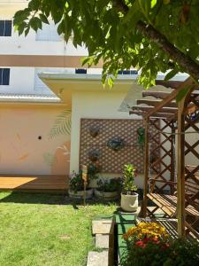 a house with a mural on the side of it at Residencial Marilis in Palhoça