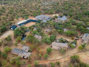 an aerial view of a village with houses and trees at Zebra Nature Reserve in Cullinan