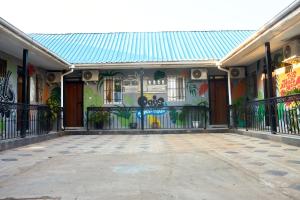 a building with a mural on the side of it at Oasis Guesthouse Juba in Juba