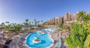 an aerial view of a resort pool with a water slide at Anfi del Mar in La Playa de Arguineguín