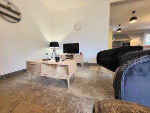 a living room with a couch and a coffee table at Sasseres Appart Souplex 6 pers Extérieur in Argelès-Gazost