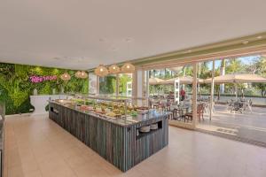 a buffet in a restaurant with tables and chairs at Anfi del Mar in La Playa de Arguineguín