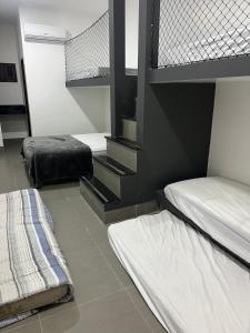 a bedroom with two bunk beds and a staircase at Apartamento Zion reserve suites in Conde