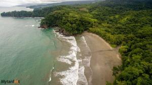 an aerial view of a beach and the ocean at Casa Rio Tortuga - Colibri in Tortugal +5 photos