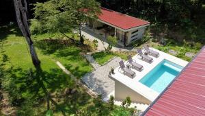 an aerial view of a house with a swimming pool at Casa Rio Tortuga - Butterfly in Ojochal