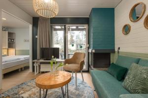 a living room with a couch and a table at Center Parcs Apartments Erperheide in Peer +18 photos