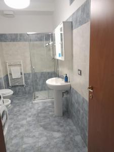 a bathroom with a sink and a shower and a toilet at Casa Molines in Giaveno +4 photos