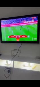 a flat screen tv sitting on top of a table at Eilena prestige in Douala