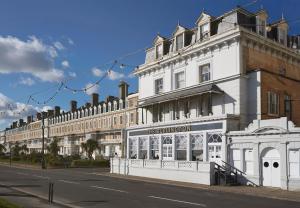 a white building on the side of a street at The Burlington in Worthing
