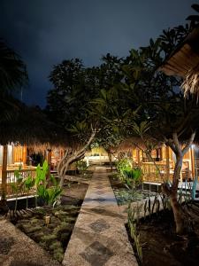 a path leading to a resort at night at Bambuu in Gili Islands