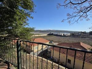 a view from the balcony of a house at Among the cherry trees B&B 6 - Nahal Dan in Metulla +2 photos