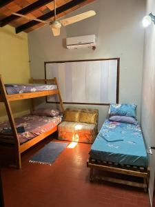 a room with two bunk beds and a couch at Villa Morra House l in Asunción