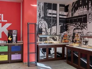 a restaurant with a black and white wall at Hostel Link in Lovran