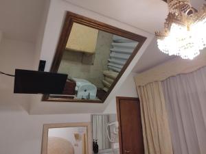 a mirror on the wall of a bathroom at Alloggi Acquavita - checkin at "Alloggi SS Giovanni e Paolo" in Venice +56 photos