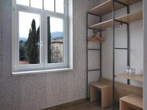 a room with a window and a view of a building at Hostel Link in Lovran +93 photos