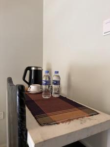 two bottles of water sitting on top of a table at Eagle View Golf in Kigali