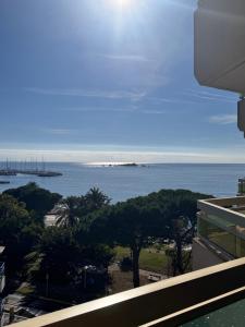 a view of the ocean from the balcony of a building at Bleu Azur -Vue Mer 6e Etage - Triangle d'Or in Saint-Raphaël