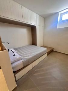 a bedroom with a bed in a room at Little Kamara Ios in Ios Chora