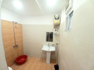 a bathroom with a sink and a toilet and a shower at Alfazal apartment in Lahore