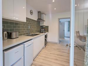 a kitchen with a sink and a counter top at Foxwhelp in Ledbury