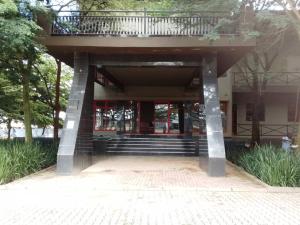 a building with a balcony on top of it at The Ivy Hotel in Lusaka