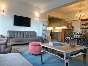 a living room with a couch and a table at Argento in Vrontádos