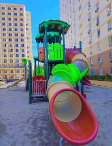 a playground with a slide in a park at Saekyung 301-1603 in Concepcion +4 photos