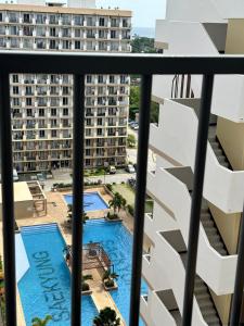 a view of the pool from the balcony of a apartment at Saekyung 301-1603 in Concepcion
