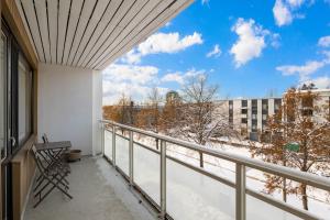 a balcony with a view of snow covered trees at Studio Esterinkatu in Imatra