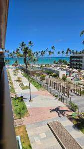 a view of the beach from the balcony of a resort at Ipioca Beach Life Maceió beira mar in Maceió
