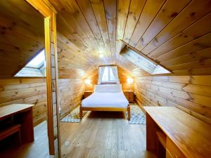 a small room with a bed in a sauna at Sweet Coppin in Ledbury