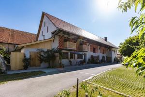 a large white building with a gambrel roof at Timeless Barn in Ljubljana