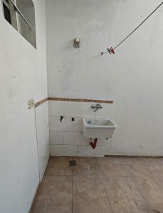 a bathroom with a sink in a room at Dpto URQUIZA Olavarría in Olavarría