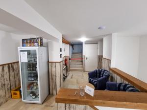 a room with a refrigerator and a table at Appartement 1 mit Terrasse in Wehlenberg