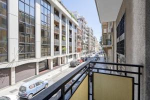 a view of a city street with cars parked on the street at AuGuStea - Modern Central Suites in Bari