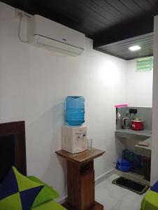 a room with a microwave on top of a table at Moonlight Resort in Anuradhapura
